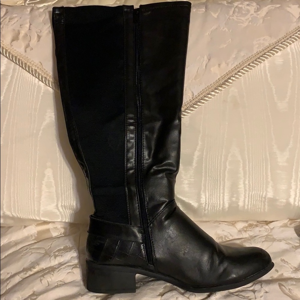 Catherine’s Black knee high boot.